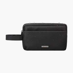 Water-resistant black Nappa packing pouch with wrist strap for travel and organization.