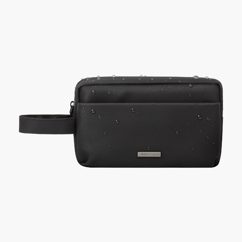 Water-resistant black Nappa packing pouch with wrist strap for travel and organization.