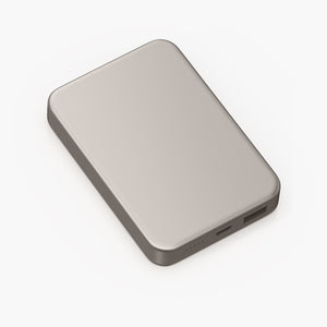 Glossey Magnetic Wireless Power Bank in sleek silver design with USB-C port and LED indicators for portable charging.