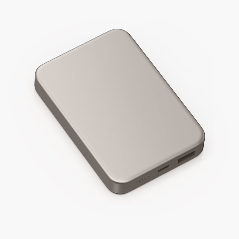 Glossey Magnetic Wireless Power Bank in sleek silver design with USB-C port and LED indicators for portable charging.