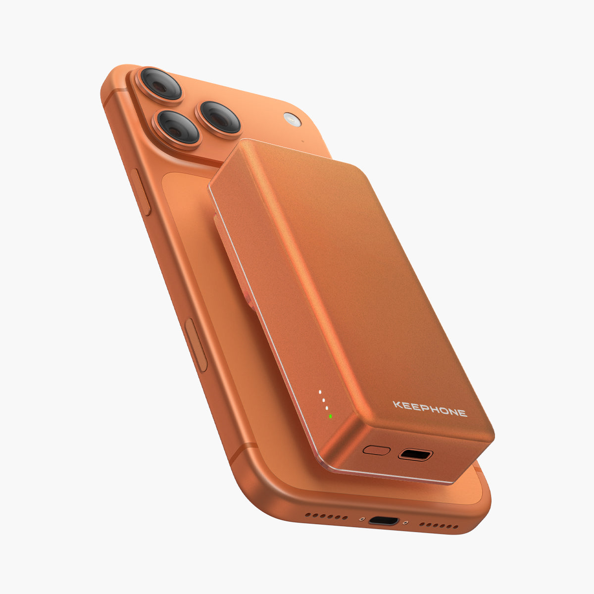 Magcube Ultra-Slim Magnetic Power Bank attached to orange smartphone, portable charger with sleek design and LED indicators.