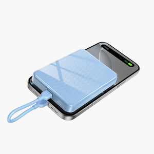 Icemag 5000mAh Magnetic Wireless Power Bank charging iPhone, portable charger with LED display and sleek blue design.