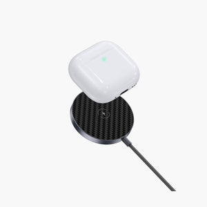 Snapad 3-in-1 Magnetic Wireless Charging Pad with MagSafe compatibility, charging AirPods on a sleek carbon fiber surface.
